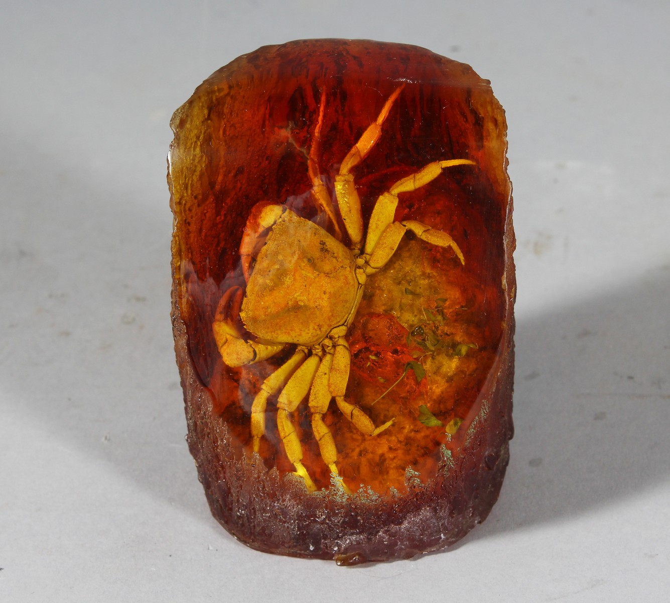 A PIECE OF AMBER with a crab. 4ins high.