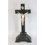AN 18TH CENTURY ITALIAN CARVED IVORY CORPUS CHRISTI on a wooden cross. 20ins high.