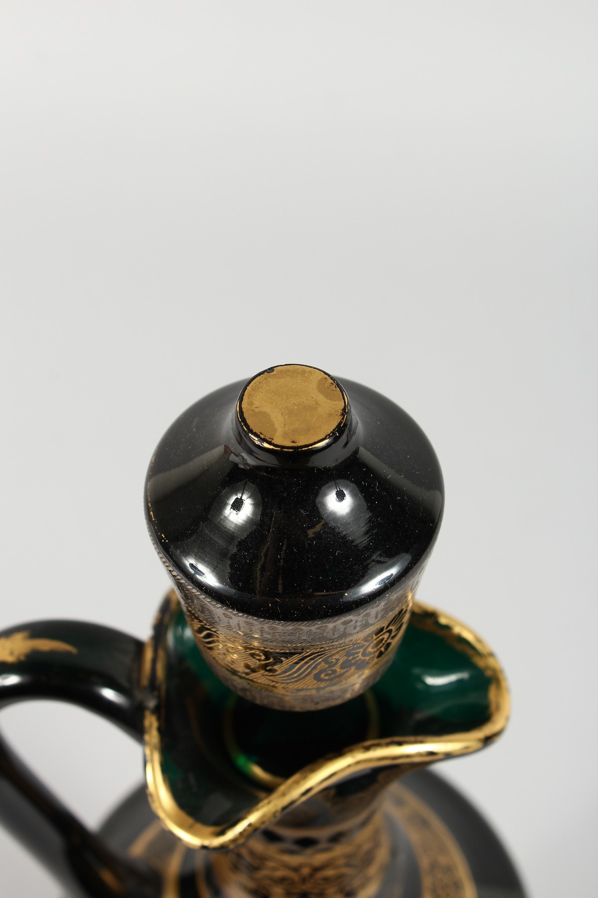 A CONTINENTAL DARK GREEN GLASS EWER AND STOPPER, with etched and gilded decoration. 14ins high. - Image 5 of 11