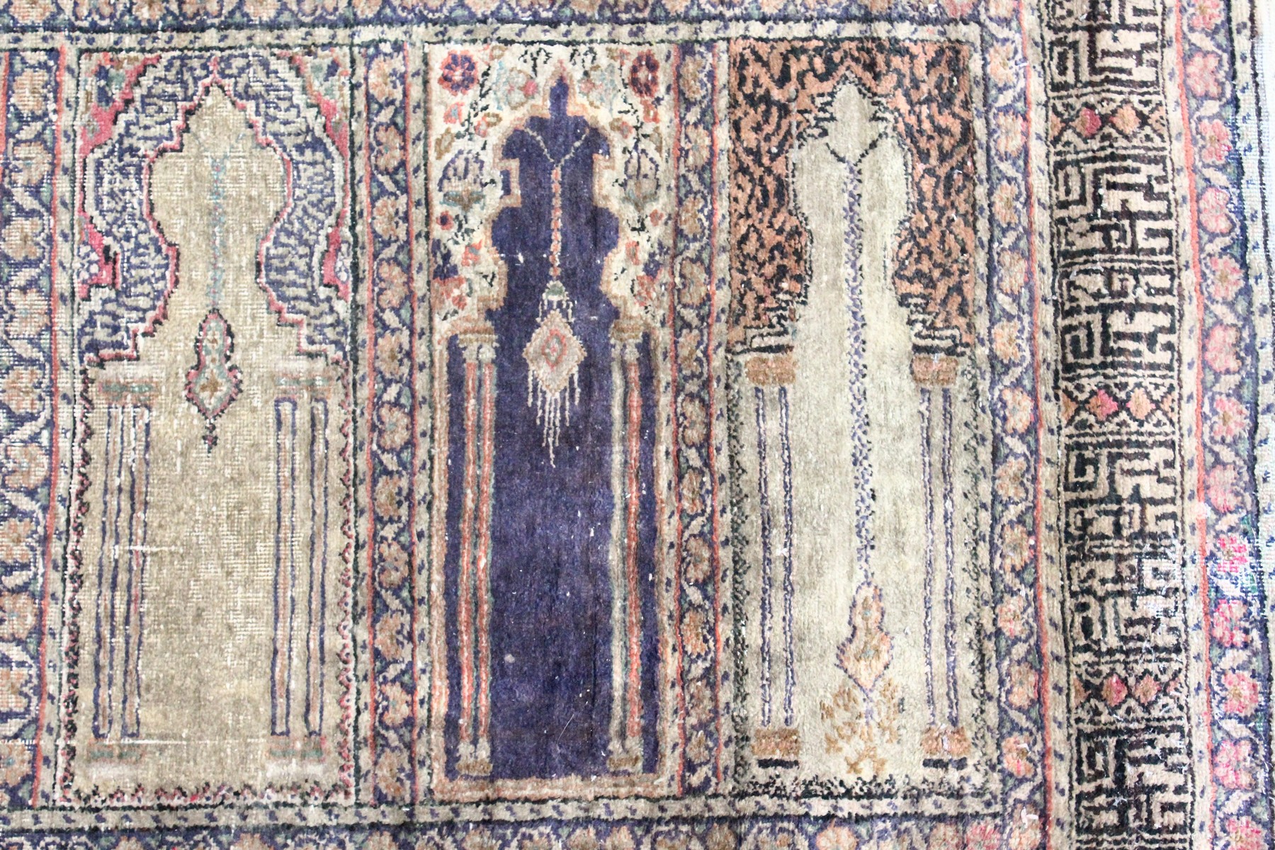 AN UNUSUAL PERSIAN PRAYER RUG, the central panel with eight arches and hanging lamps, within a - Image 9 of 10