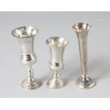 THREE SILVER MINIATURE VASES.