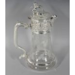 A GOOD GLASS CLARET JUG, engraved with fruiting vines, with plated lid and handle. 11ins high.