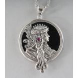 AN ART NOUVEAU DESIGN RUBY SET SILVER MUCHA PENDANT on a chain.