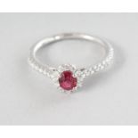 A WHITE GOLD OVAL SPINEL (0.48cts) PAVE DIAMOND (0.32cts) RING.
