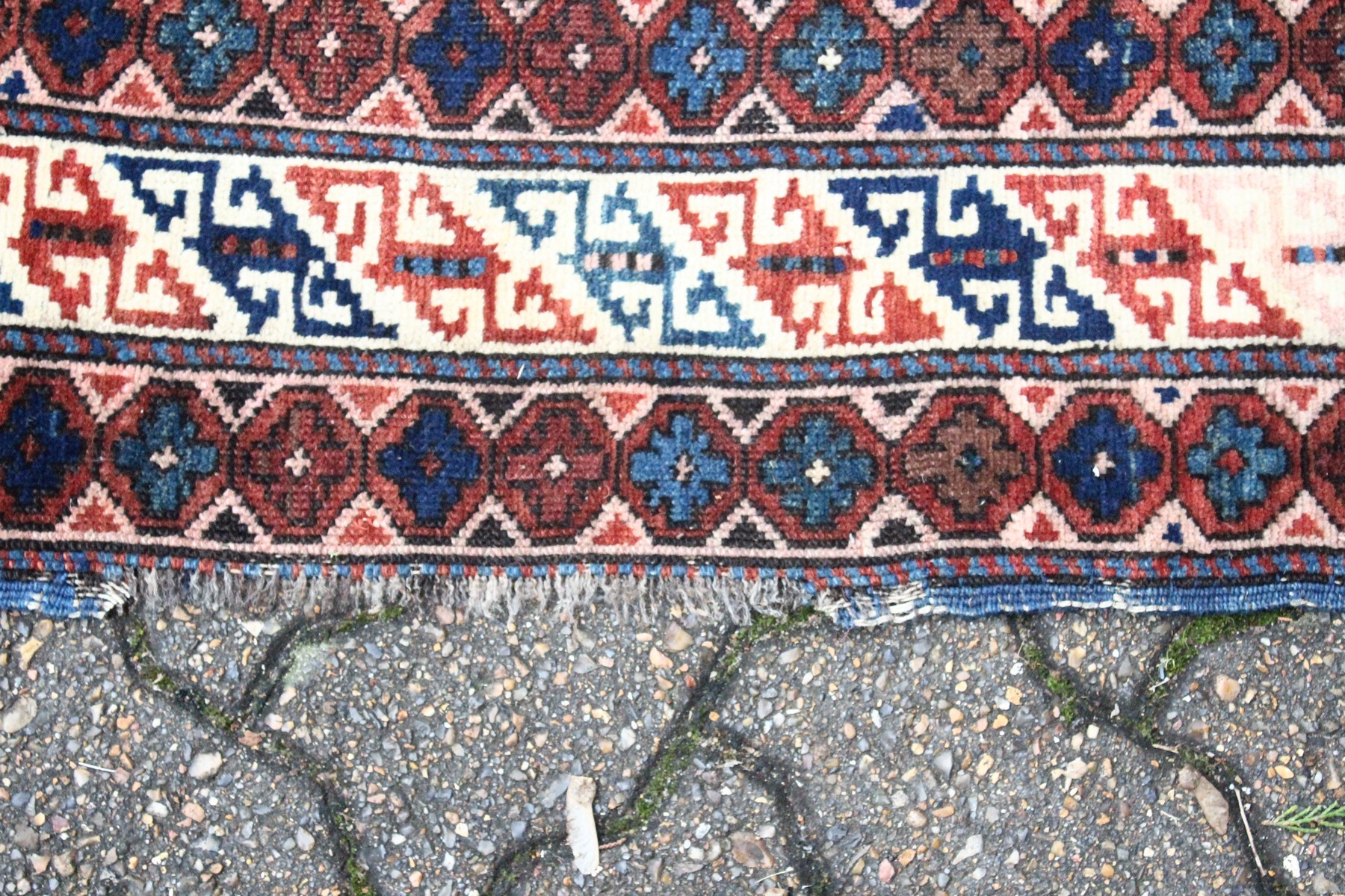 A CAUCASIAN RUG, mid 20th century, dark blue ground with stylised decoration within a five row - Image 4 of 5