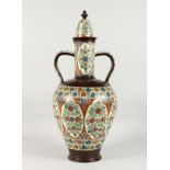 A LARGE TURKISH POTTERY TWO-HANDLED VASE AND COVER. 24ins high.
