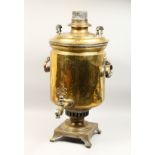 A LARGE 19TH CENTURY RUSSIAN BRASS SAMOVAR with carrying handles on square base with curving feet.