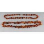 TWO AMBER NECKLACES.