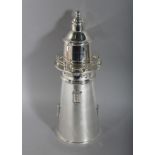 A SILVER PLATED LIGHTHOUSE COCKTAIL SHAKER. 14ins high.