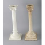 TWO CREAMWARE CORINTHIAN COLUMN CANDLESTICKS. 12ins high.