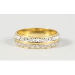 AN 18CT GOLD TWO-ROW DIAMOND ETERNITY RING.
