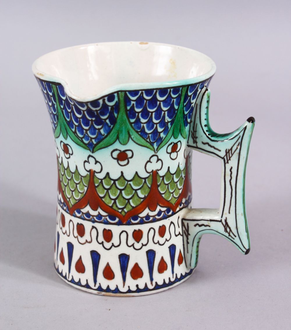 A 19TH CENTURY IZNIK STYLE CANTAGALLI JUG, with floral panel motif, 10cm.