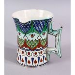 A 19TH CENTURY IZNIK STYLE CANTAGALLI JUG, with floral panel motif, 10cm.