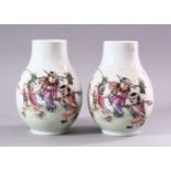 A PAIR OF CHINESE REPUBLICAN STYLE PORCELAIN VASES, each painted with scenes of playful treatment,
