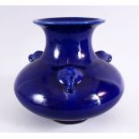 A CHINESE BLUE GROUND TRIPLE HANDLE PORCELAIN VASE, With a deep royal blue ground, with triple