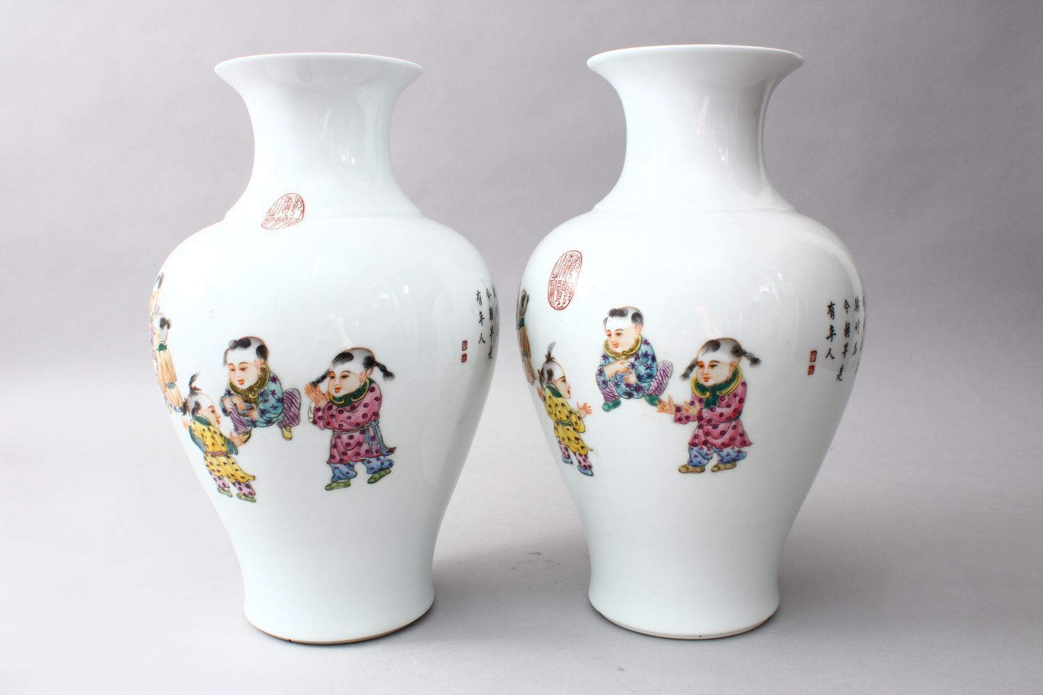 A PAIR OF CHINESE REPUBLIC PERIOD FAMILLE ROSE PORCELAIN VASES OF BOYS PLAYING, the body of the - Image 4 of 6