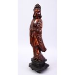 A GOOD JAPANESE MEIJI PERIOD CARVED WOOD OKIMONO OF KWANNON, stood holding a scroll, fitted to a
