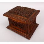 A GOOD 19TH CENTURY CHINESE CANTON CARVED WOODEN CASKET, the top carved with typical canton scenes