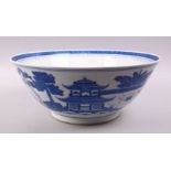 A LARGE CHINESE BLUE & WHITE PORCELAIN BASIN, decorated with native views of a landscapes both