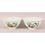 A GOOD QUALITY PAIR OF CHINESE FAMILLE ROSE PORCELAIN PEACH BOWLS, the body of the bowls with