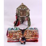 A BALOCHISTAN HEAD DRESS, adorned with coins, rings, beads etc. together with associated overshirt.