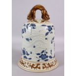 A CHINESE BLUE, WHITE & BISCUIT MING STYLE DRAGON PORCELAIN TEMPLE BELL, the body with moulded