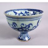 A CHINESE BLUE & WHITE PORCELAIN STEM CUP - FOR THE ISLAMIC MARKET, decorated with scrolling flora