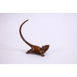 A JAPANESE BRONZE FIGURE OF A RAT , looking aloft with his tail raised, stamped seal to base, 8cm.