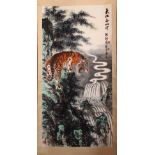 A GOOD 20TH CENTURY CHINESE SCROLL PAINTING, depicting a growling tiger standing on a rocky