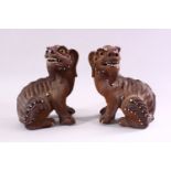 A GOOD PAIR OF CHINESE 19TH CENTURY TERRACOTTA FORMED LION DOG FIGURES, the mirrored pair with