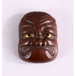 A JAPANESE MEIJI PERIOD BRONZE NOH MASK, with gilt eye decoration, 5.5cm high x 4cm