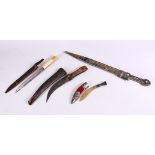 A 20TH CENTURY RUSSIAN KINJAL DAGGER with filigree decoration and three other knives.