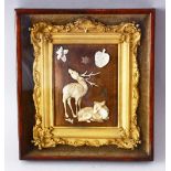 A SMALL JAPANESE CARVED IVORY AND MOTHER OF PEARL PICTURE, depicting a stag and a doe, mounted in