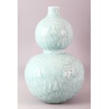 A GOOD LARGE CELEDON GLAZED DOUBLE GUARD VASE, incised with fruiting vine, six character mark to