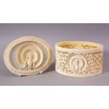 A FINE EARLY 20TH CENTURY IVORY TUSK BOX AND COVER, the cover pierced and carved with a peacock, the