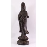 A LARGE 19TH / 20TH CENTURY CHINESE CARVED HARDWOOD FIGURE OF GUANYIN, stood upon a lotus base,