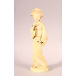 AN EARLY 20TH CENTURY JAPANESE CARVED IVORY OKIMONO OF A GEISHA GIRL, mark to base, 20cm high.