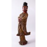 A LARGE 19TH CENTURY CHINESE CARVED AND LACQUERED WOODEN FIGURE OF GUANYIN, with carved wave
