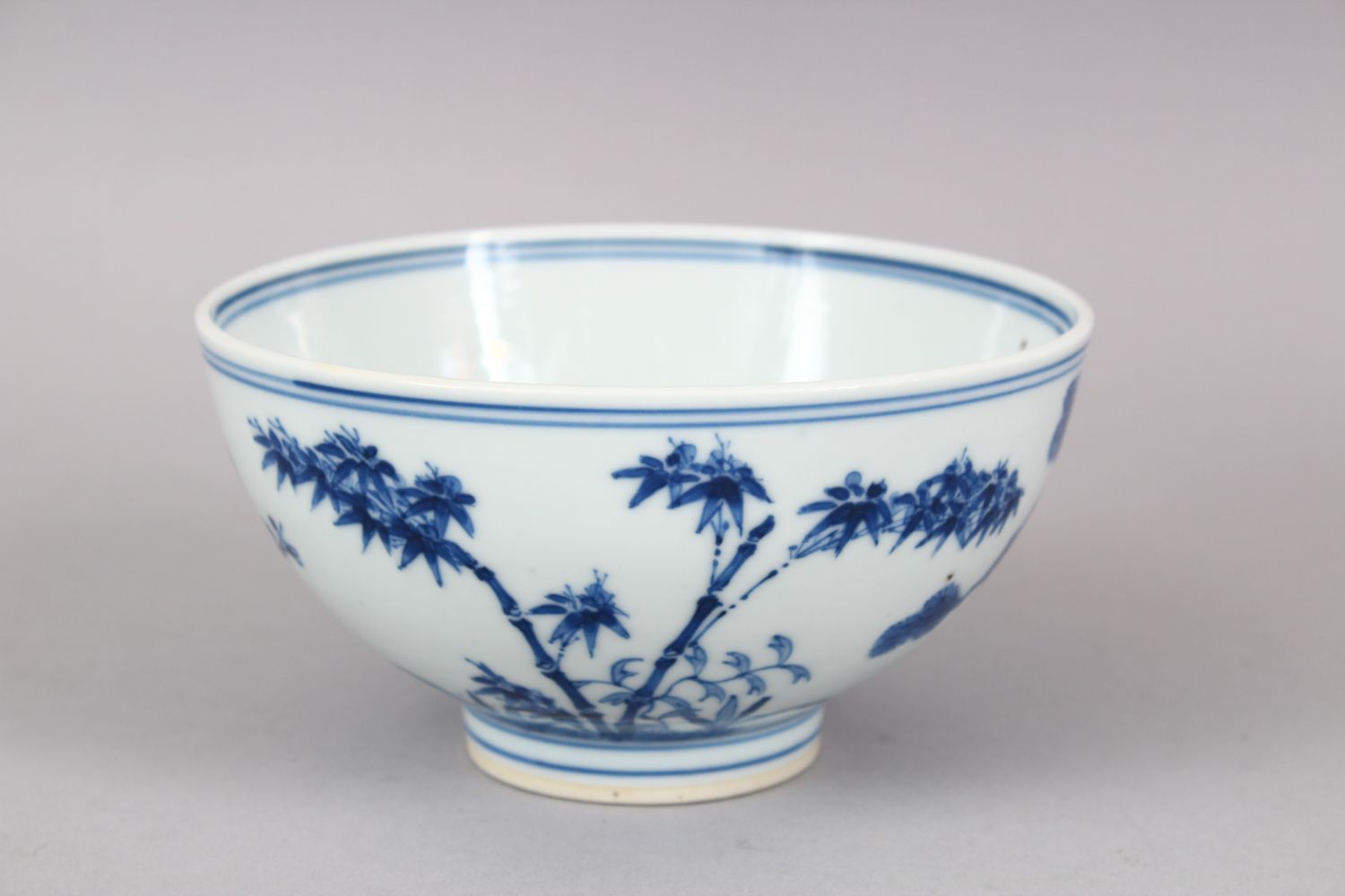 A CHINESE BLUE & WHITE PORCELAIN BOWL, the body with native flora and foliage, the base with a six - Image 2 of 6