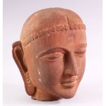 A GOOD HEAVY CARVED STONE BUST of an Indian female, 28cm high.