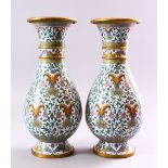 A PAIR OF CHINESE CLOISONNE BALUSTER SHAPE VASES, with floral sprays and lotus flowers, 31cm.