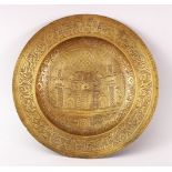 A 19TH CENTURY PERSIAN ENGRAVED CALLIGRAPHIC BRASS DISH, with bands of calligraphy and temple