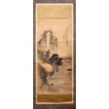 AN EARLY 20TH CENTURY CHINESE SCROLL PAINTING, with a fisherman in a boat on a lake beneath a