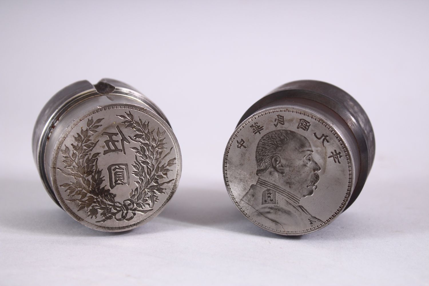 TWO GOOD CHINESE COIN / CURRENCY MOULDS OR PRESS, one with a figure and calligraphy, the other