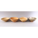 A GROUP OF FOUR EARLY CHINESE EARTHENWARE CIRCULAR BOWLS, various sizes.