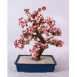 A JAPANESE CARVED HARD STONE FIGURE OF A BONSAI, depicting a cherry blossom tree, 42cm high x 25cm
