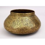 A GOOD 19TH CENTURY DAMASCUS BRASS CARVED BOWL, the bowl carved with formal floral motif, 25cm.