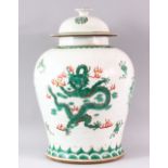 A LATE 19TH / EARLY 20TH CENTURY FAMILLE VERTE TEMPLE JAR AND COVER, painted with dragons and