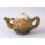 A 19TH / 20TH CENTURY CHINESE CARVED NATURALISTIC TEA POT & COVER, the body carved with fruit