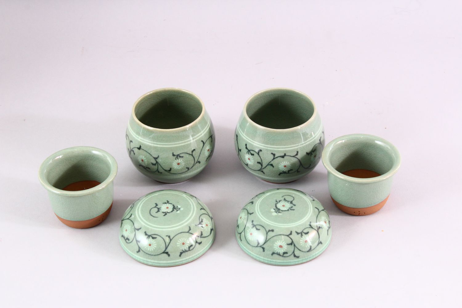 THREE 20TH CENTURY KOREAN CELADON PORCELAIN TEA SET, the body decorated with formal floral - Image 2 of 6